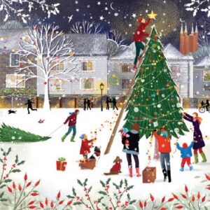 Image shows a wintery scene of peopl putting up a Christmas Tree in a village square